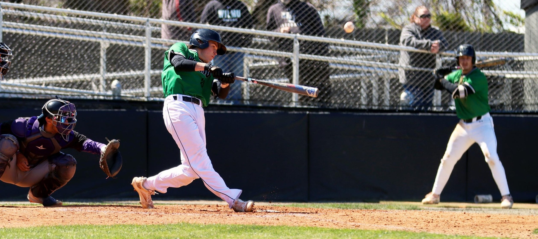 Photo of Erik Grady delivering one of his RBI base hits in game one against Bridgeport. He went 4-for-8 with a triple and 5 RBI in the doubleheader. Copyright 2023; Wilmington University. All rights reserved. Photo by Dan Lauletta. March 30, 2023 vs. Bridgeport.