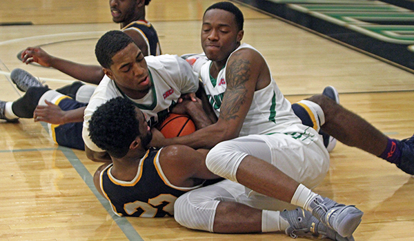 Copyright 2016; Wilmington University. All rights reserved. Photo of Tajee Almon and Brian Adkins going all out for a loose ball, taken by Frank Stallworth.
