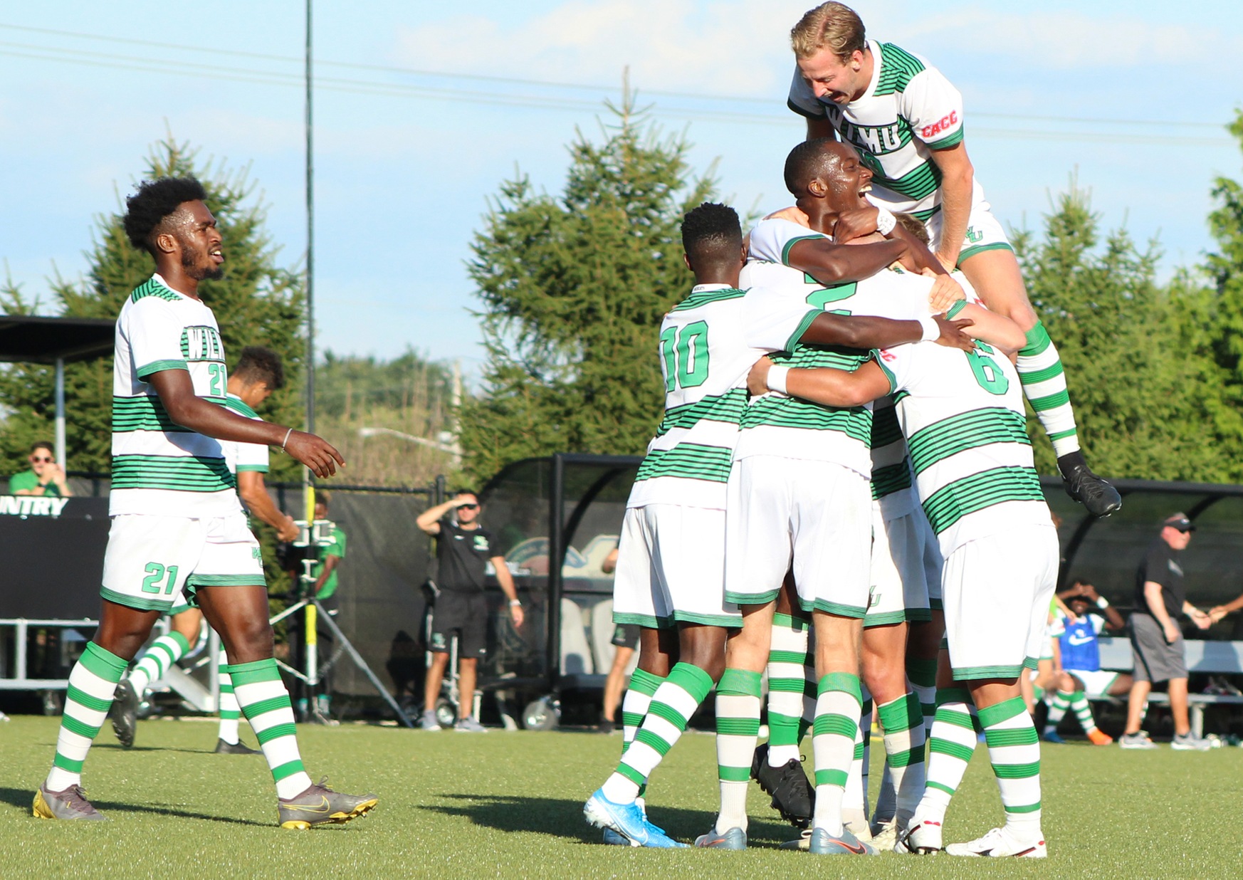 Wilmington University players celebrate Joe Bell's winning goal against Southern New Hampshire University during their NCAA Division II Men's soccer match at the Wilmington University Sports Complex in Newark, Delaware,  September 18, 2019 photo by Emma Whitesel
