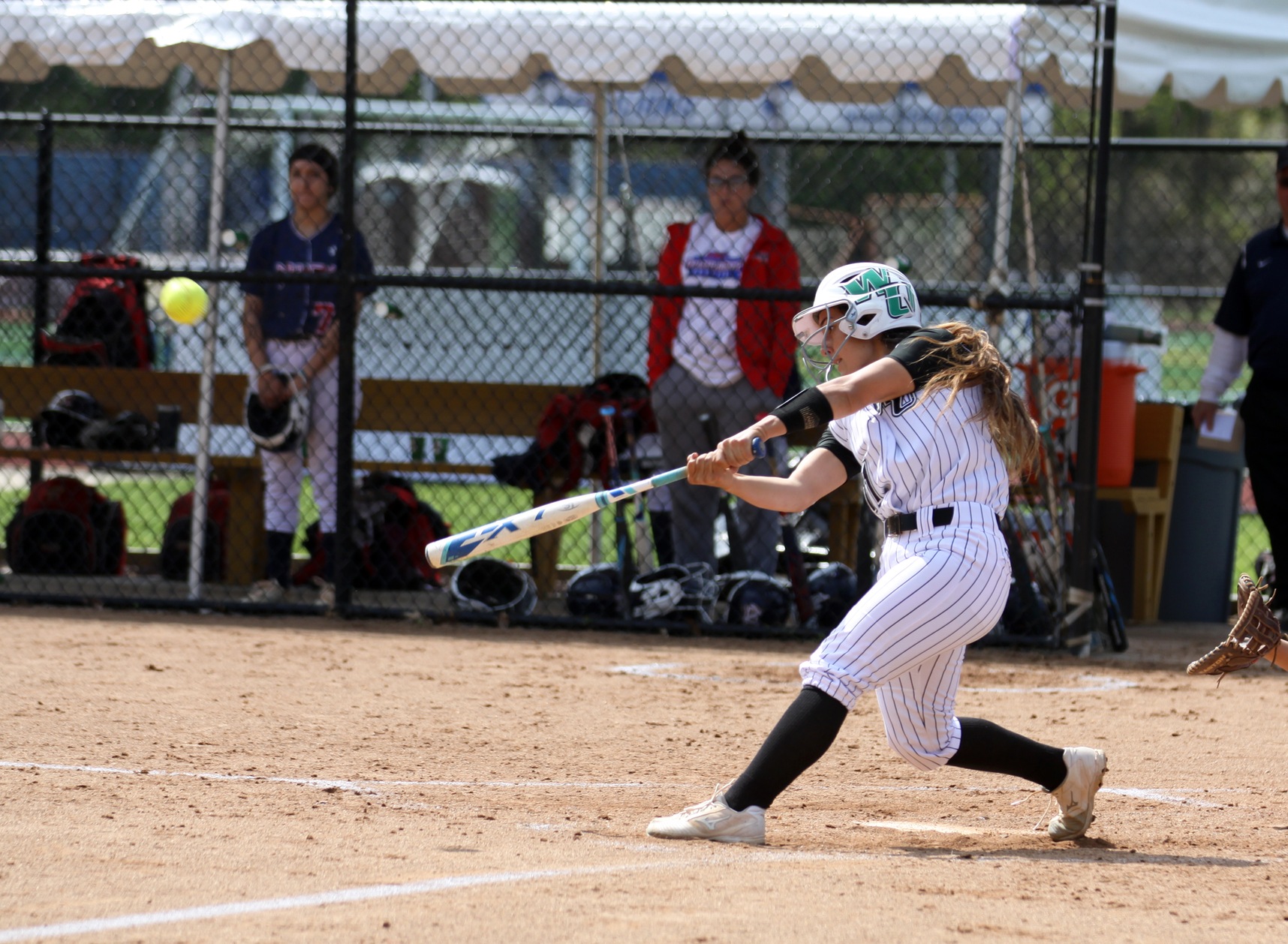 Copyright 2019; Wilmington University. All rights reserved. Photo of Annie Davila hitting her three-run homer against Nyack in the CACC Tournament. Photo by Erin Harvey. May 2, 2019 vs. Nyack in CACC Tournament.