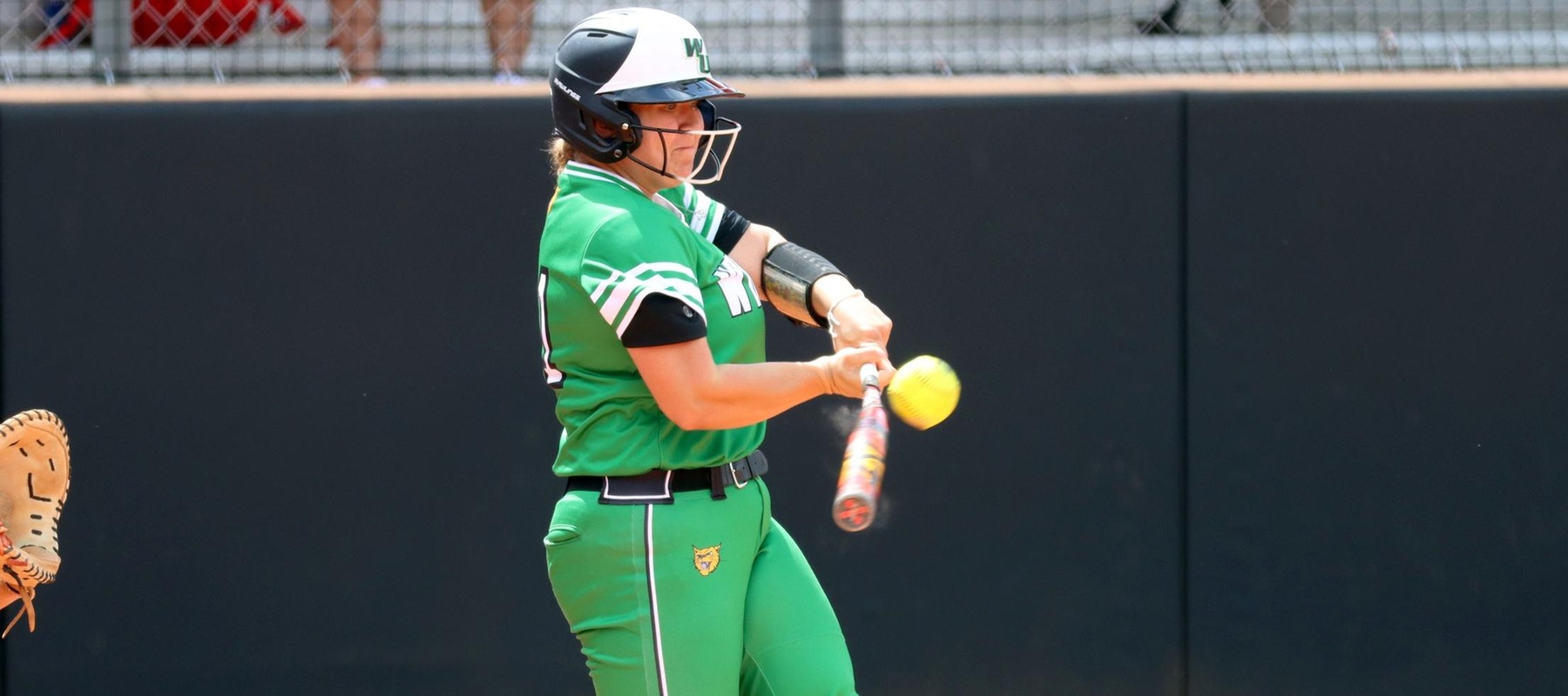 Photo of Hannah Parks connecting on a two-run single in game one against #4 Tampa. Copyright 2024; Wilmington University. All rights reserved. Photo by Erin Harvey. March 7, 2024 at Tampa.