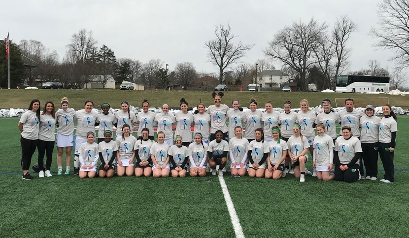 The Wildcats and Tigers took part in the Lax-4-Life Campaign today, playing for suicide prevention awareness. Photo of both teams prior to today's game. Courtesy of Greg Pellegrino, Holy Family University sports information director.