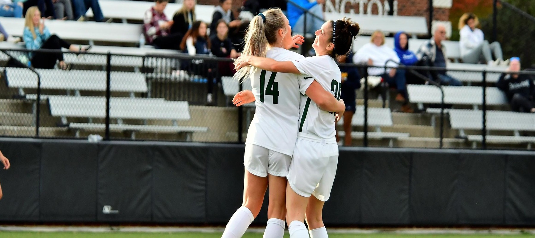 Photo of Lauren Hoelke (14) and Jimena Garcia Risoto (29) celebrating after Hoelke's second goal. Copyright 2021; Wilmington University. All rights reserved. Photo by James Jones. October 28, 2021 vs. Georgian Court.