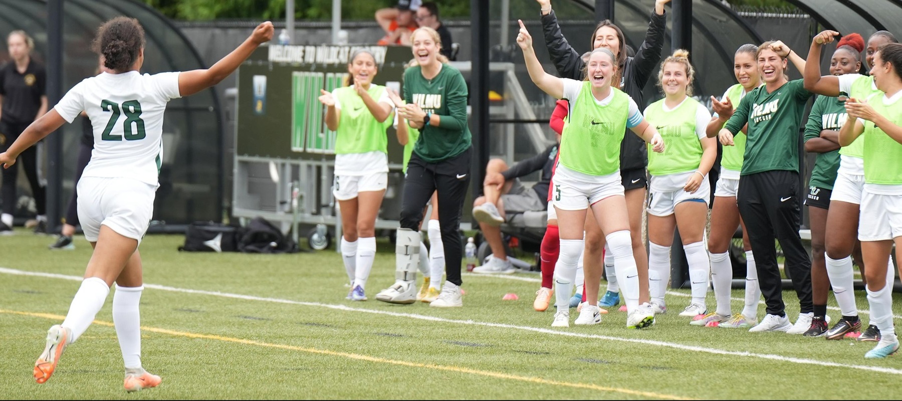 Wilmington University’s Sharon Freire Omonigho #28 celebrates with the team’s coaches and bench after scoring against the Bloomfield College Bears during their NCAA Women’s soccer match at the Wilmington University Sports complex in Newark, Delaware, September 30, 2023. Photo By Giovanni Badalamenti