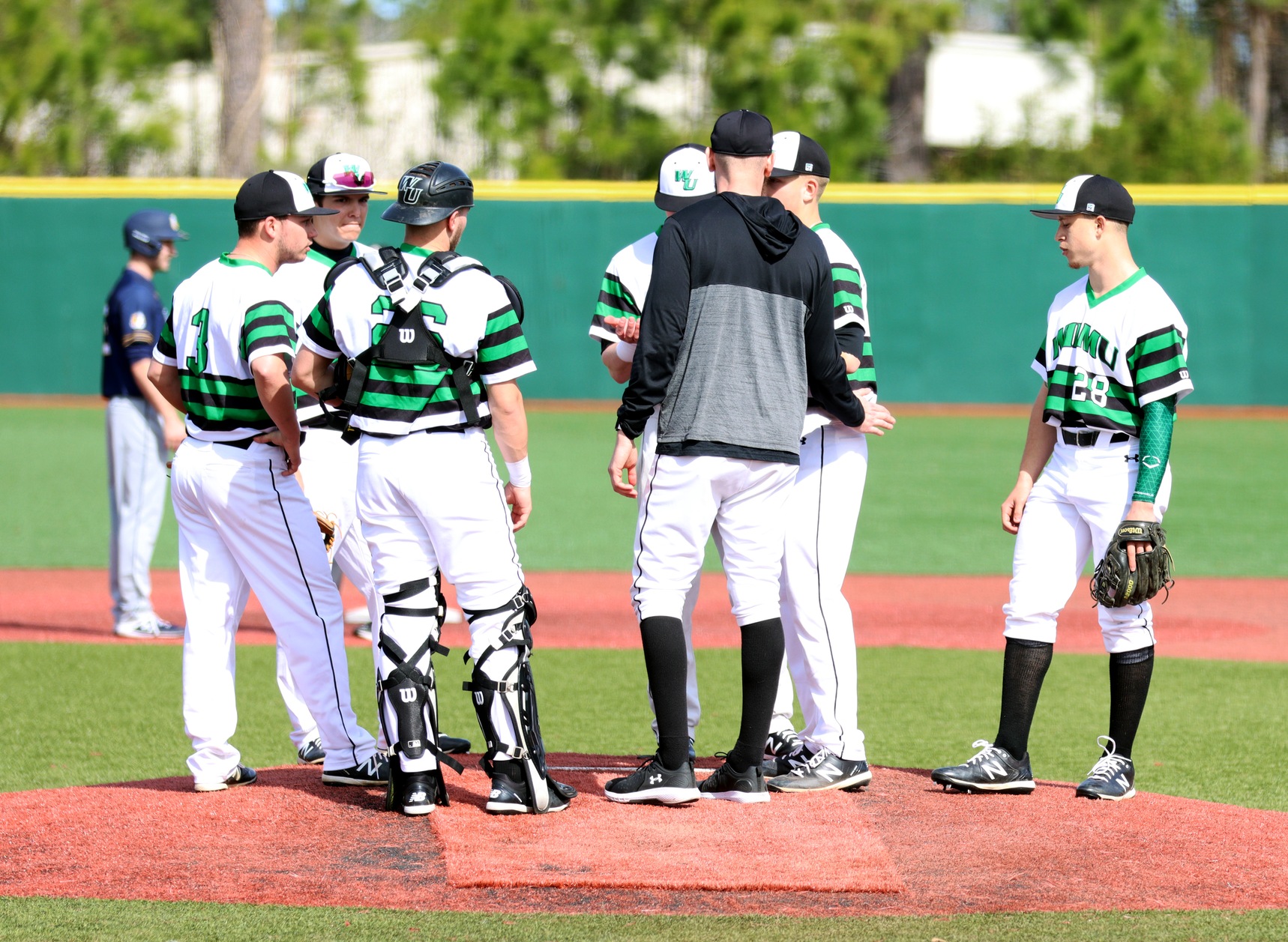 Photo by pitching coach Anthony Cimabue talking to starter Matt Warrington. Copyright 2020; Wilmington University. All rights reserved. Photo by Dan Lauletta. February 23, 2020 vs. New York Tech in Myrtle Beach.