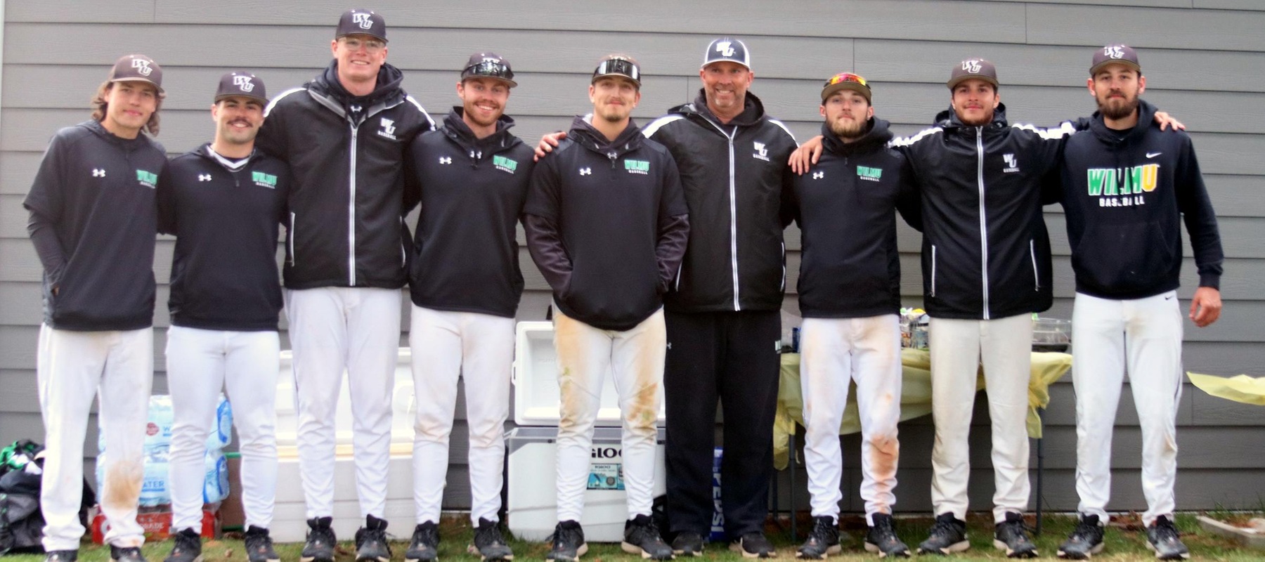 Photo of the seniors with head coach Brian August after the sweep of Caldwell. April 21, 2024.