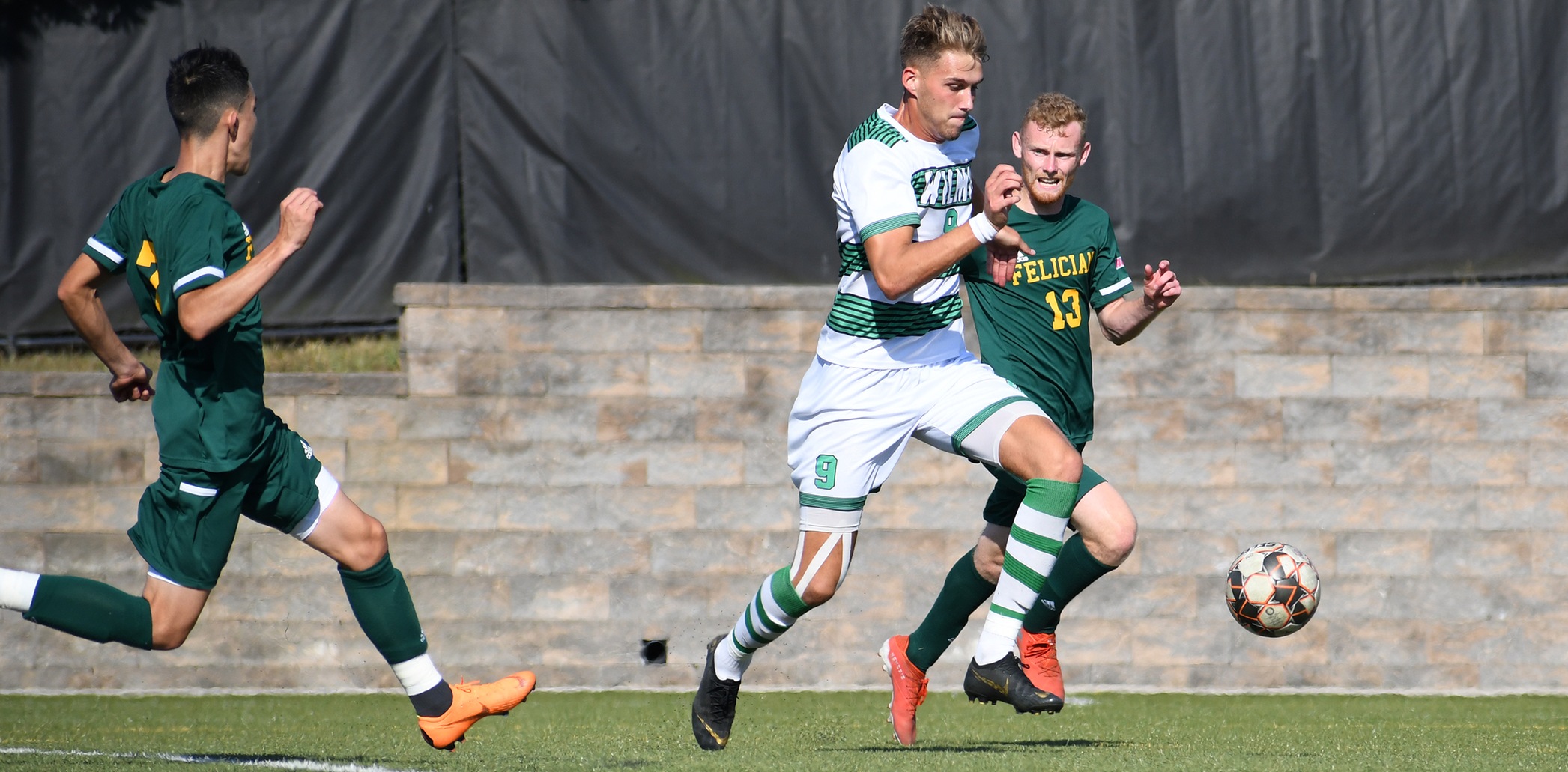 Wilmington University’s player Lorne Bickley (9) controls the ball as Felician College players Dean Wright (13) and Jorge Zerna (7) follow the play during the Men’s NCAA division II soccer match at the Wilmington University sports complex, Saturday September 21, 2019. Photo by Keyana Ringgold