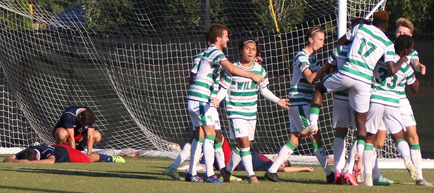 Wilmington University players celebrate the game winning goal during their hard-fought victory over Nyack College during their NCAA men?s soccer match at the Wilmington University sports facility in Newark, DE. October 2, 2021. Roger Bain, Photographer