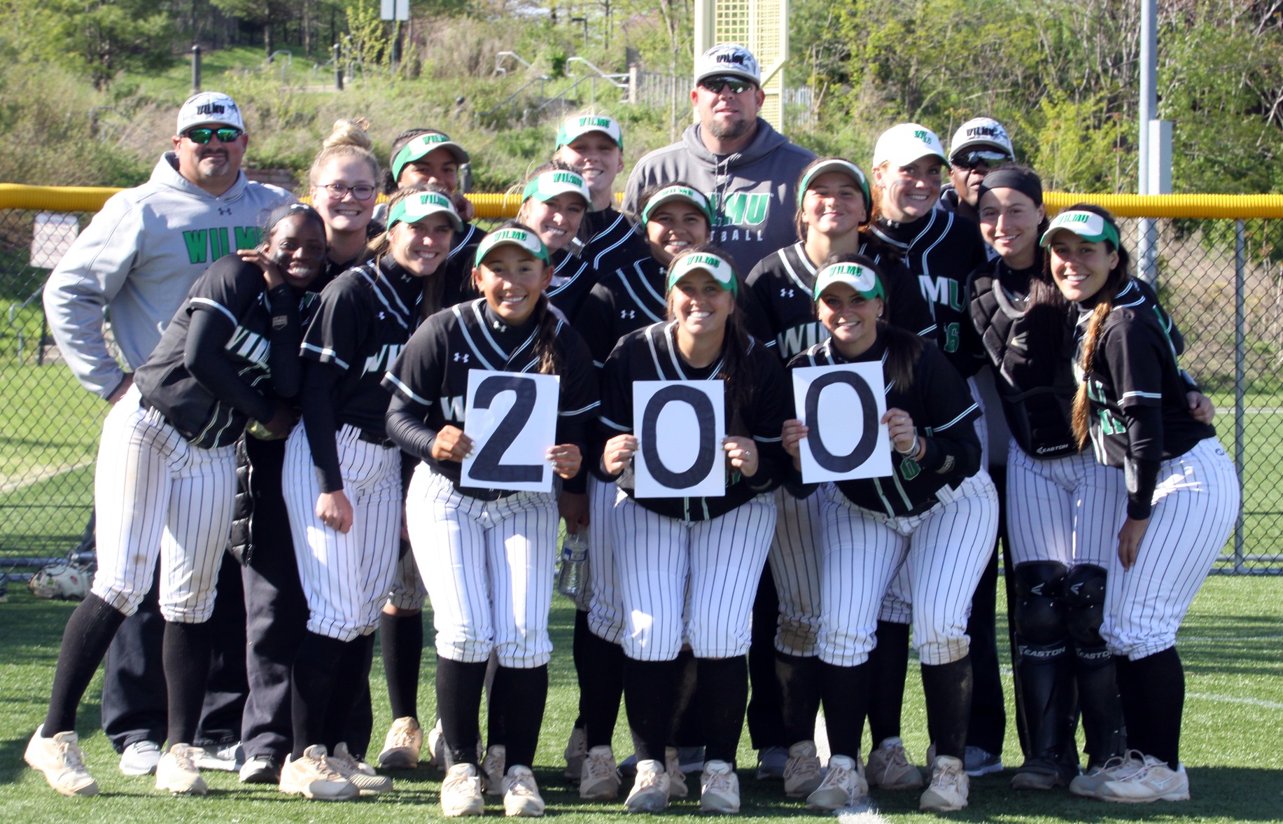 Copyright 2019; Wilmington University. All rights reserved. Photo of the team celebrating with head coach Mike Shehorn for his 200th career win after game one. Taken by Dan Lauletta. April 27, 2019 at Felician.