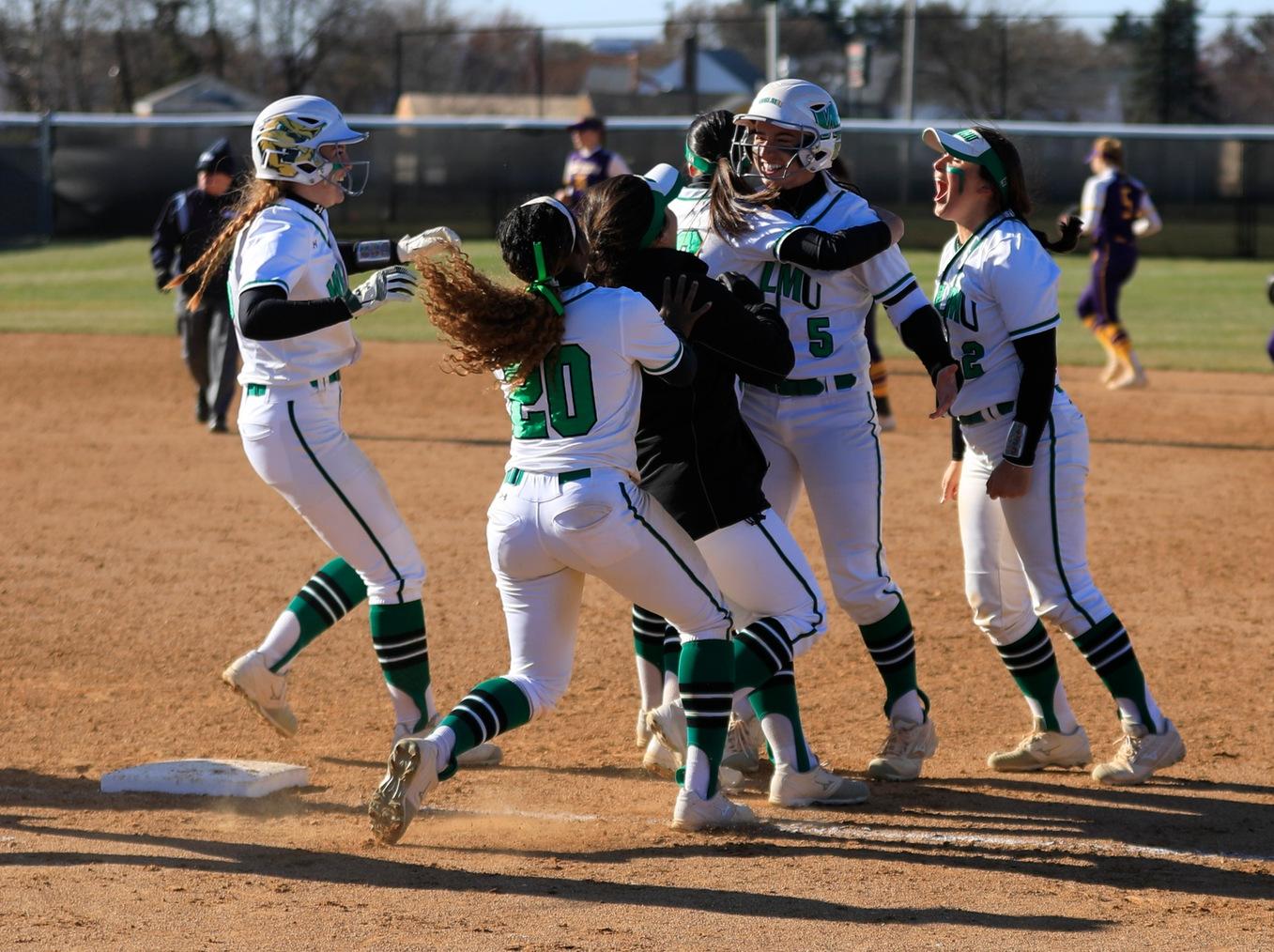 Copyright 2019; Wilmington University. All rights reserved. Photo of the celebration after Angela Antonini's walk-off against West Chester. Photo by Chris Vitale. March 26, 2019 vs. West Chester.