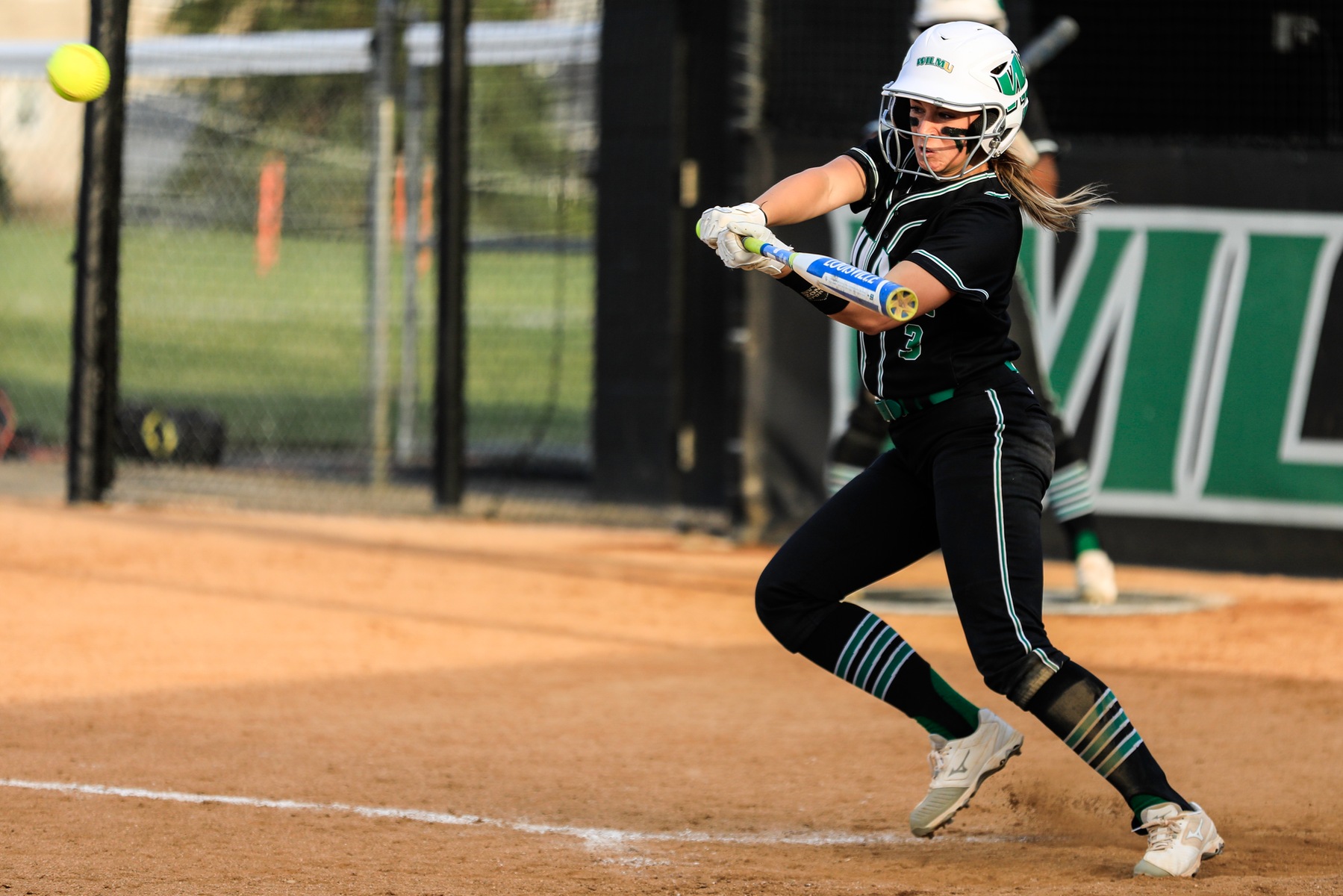 Copyright 2019; Wilmington University. All rights reserved. Photo of Alexis Sann hitting the game-winning single in the bottom of the fifth in game two. Photo by Christ Vitale. April 4, 2019 vs. Chestnut Hill (Game 2).