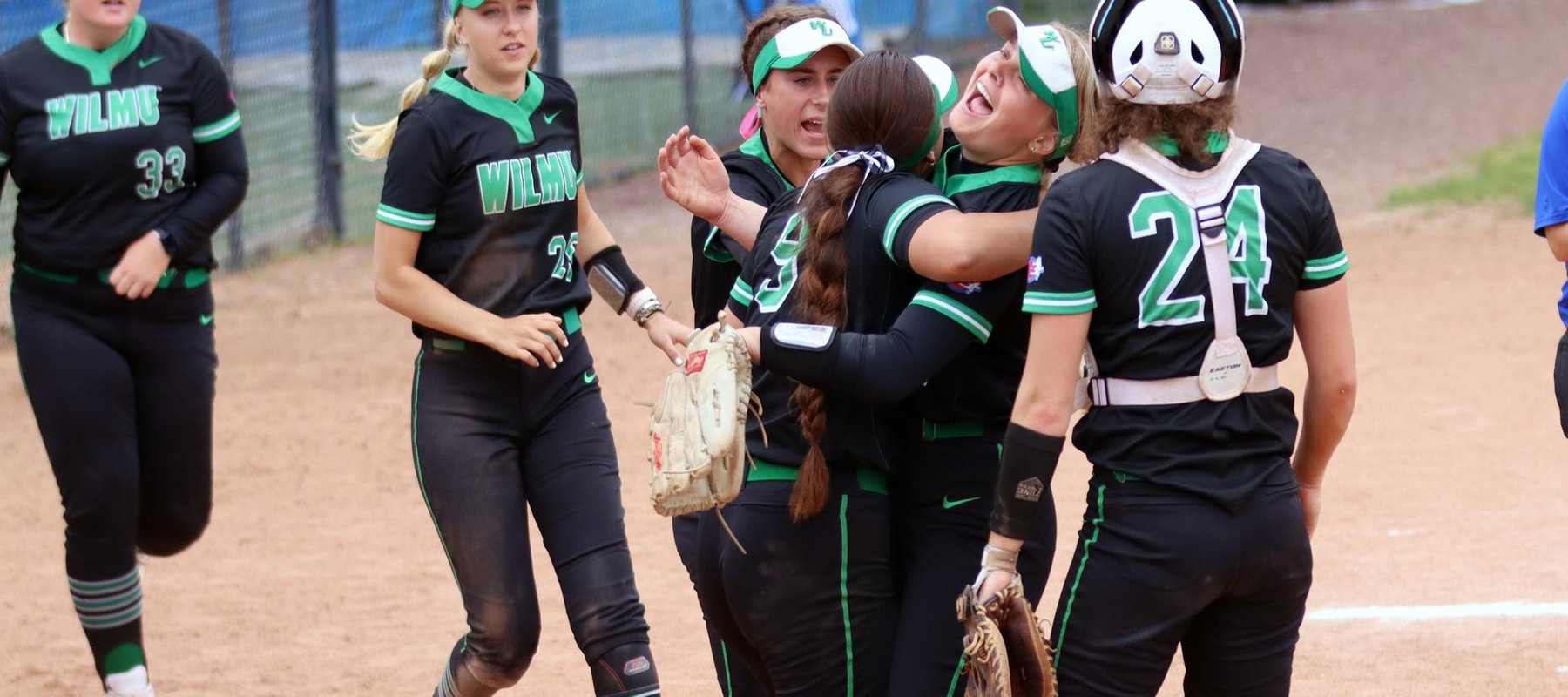 Photo of Renamarie Rocha meeting Kylee Gunkel after the freshman got out of the 6th inning bases-loaded jam to keep the score, 2-1. Copyright 2022; Wilmington University. All rights reserved. Photo by Dan Lauletta. May 13, 2022 vs. Georgian Court in NCAA Regional at GCU.