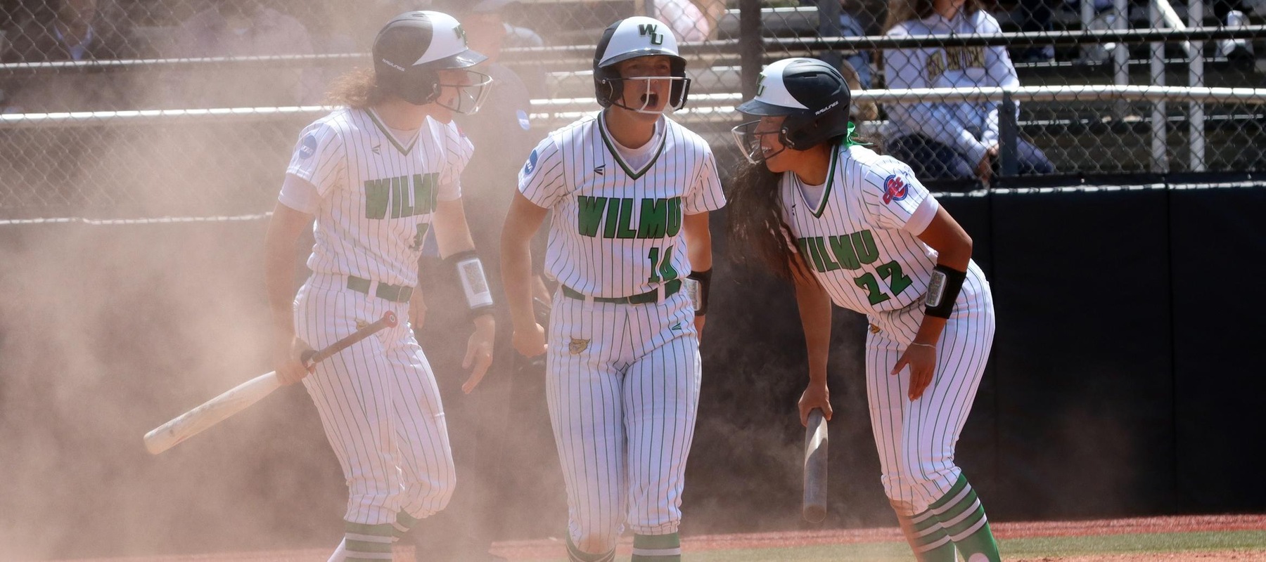 Photo of Sara Miller and Gabbie Saucedo scoring after a two-run single by Bri Coyle in game one. Copyright 2023; Wilmington University. All rights reserved. Photo by Dan Lauletta. May 18, 2023 vs. Adelphi in game one of Super Regionals.