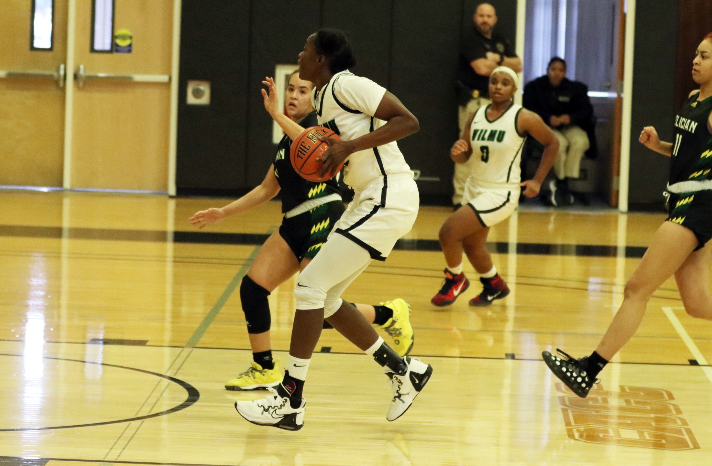 photo of Fatou Ndao against Felician. Copyright 2023; Wilmington University. All rights reserved. Photo by Dan Lauletta.