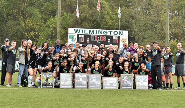 Copyright 2017; Wilmington University. All rights reserved. Photo of the seniors, the team, and their families following the Senior Day Ceremonies, taken by James Jones.