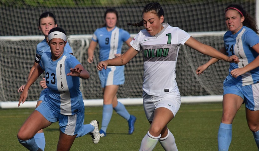 Wilmington University player Kelly Robbins (#1) beating the Holy Family's defenders to score the first goal of the game during their NCAA Division II Women's Soccer match at the Wilmington University sports complex in Newark, Delaware September 26, 2018. Photo by Eric Melchior