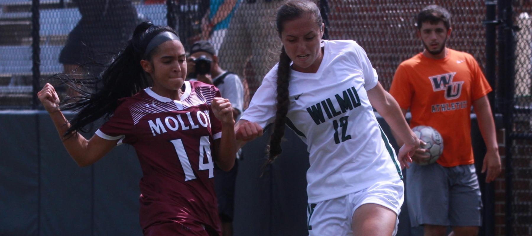 Wilmington University player Kasie Lambert (12) battles for possession with Molloy College player Joanna Graca (14) during their NCAA women?s soccer match at the Wilmington University sports facility in Newark, Delaware, September 11, 2021. Photo by Jeff Batt
