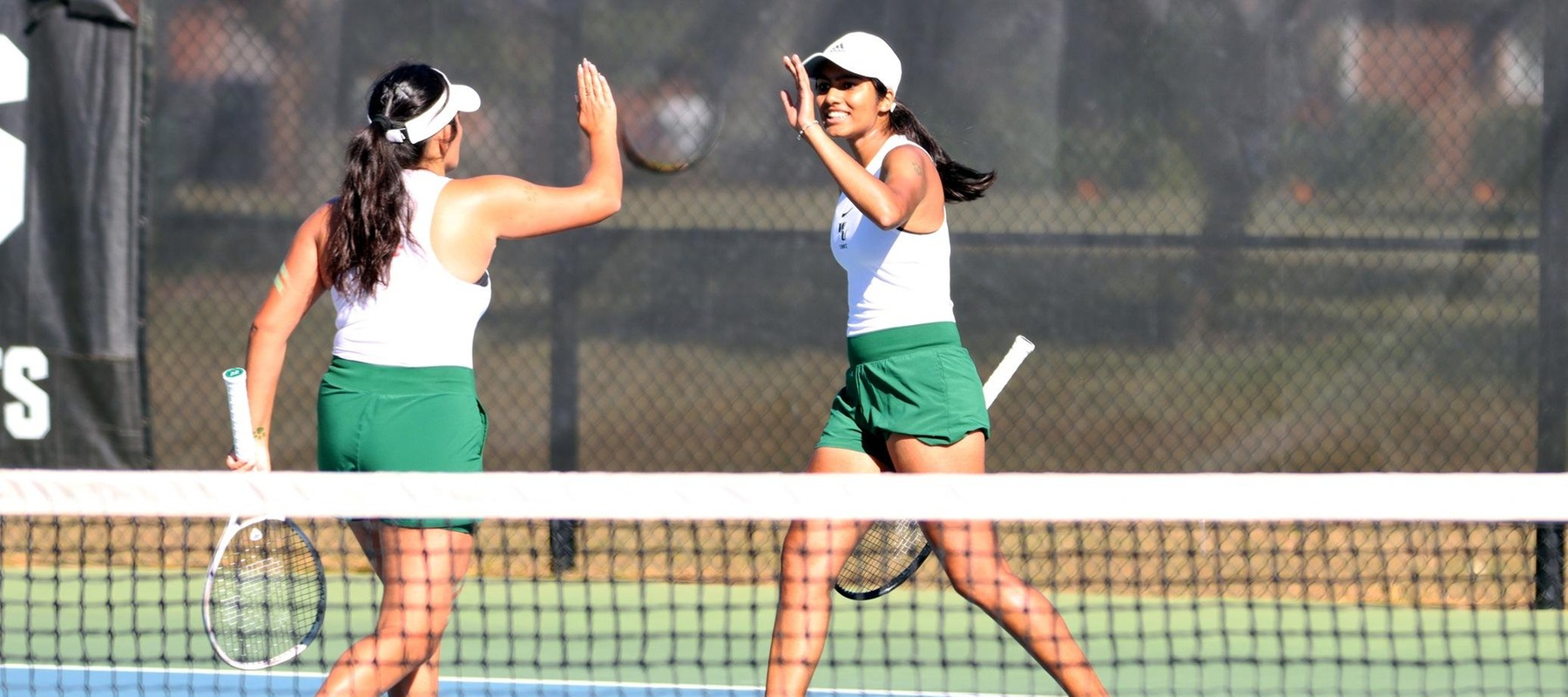 Photo of Kushi Khandoji (right) and Siana MacDonald celebrating a point at No. 3 doubles on Saturday against Jefferson. Copyright 2024; Wilmington University. All rights reserved. Photo by Dan Lauletta. October 19, 2024.